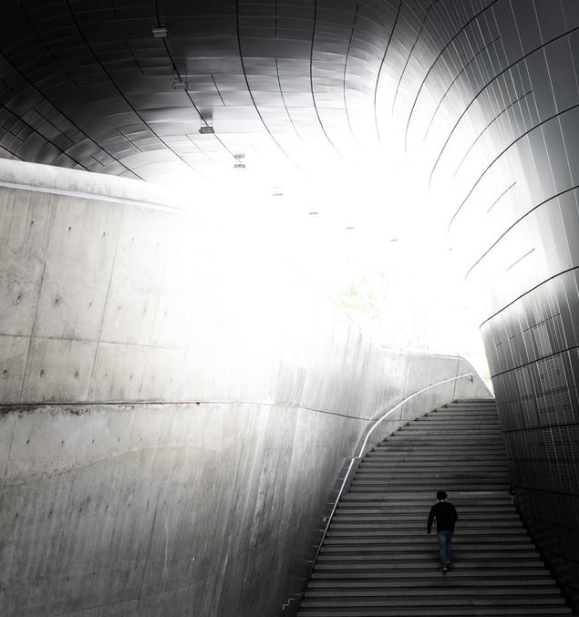 A person walking up a flight of stairs